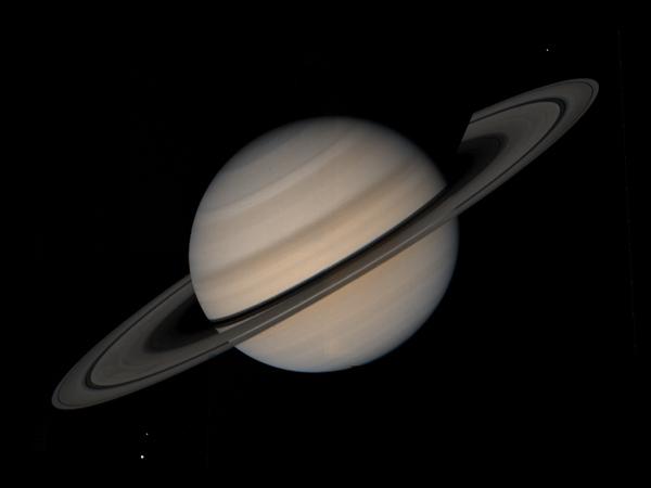 Saturn's dizzying spin hints at quick birth | New Scientist