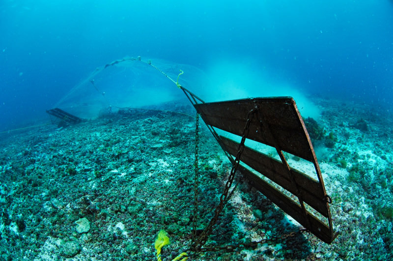 Bottom trawler scrapes the sea bed