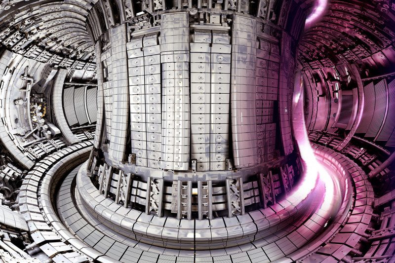 Inside of fusion reactor JET, showing a purple plasma on the right