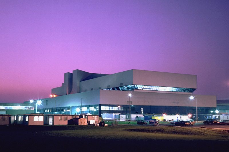 The JET building at night against a purple sky